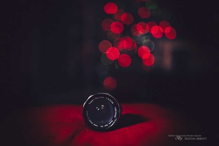 © 2015 Thousand Word Images by Dustin Abbott How about a little Seuss to brighten up your winter day? A blizzard is pounding us outside (after our green Christmas a few days ago), but I had a little fun with strobes, a new Canon 35L II lens, and an old Super Takumar 35mm f/3.5 lens. An old lens, new lens, and a red ring lens. The red surface gives a little royal touch to it all. Technical info: Canon EOS 6D, Canon EF 35mm f/1.4L II USM, Processed in Adobe Lightroom CC, Adobe Photoshop CC, and Alien Skin Exposure X (Use Code "dustinabbott" to get 10% anything and everything) Want to know more about me or make contact? Take a look at my website and find a lot of ways to connect and view my work.