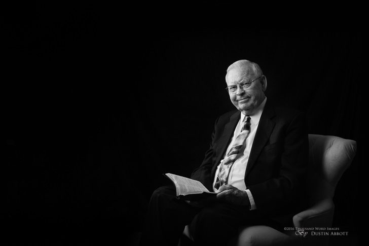 © 2016 Thousand Word Images by Dustin Abbott My father was here for a visit for the past week and a half to celebrate the fact that I'm about to turn 40. My father is (like me) a Pentecostal minister. This portrait captures him with his familiar Bible. He loves to read and study it. Though his health is frequently poor, he continues to travel around North America ministering at different churches. This portraits honors the man I love and celebrates his influence in my life. I'm becoming more familiar with the nuances of the 5DsR. You can see my first video on it here: http://bit.ly/28XKjG4. The amount of resolution it produces is really overkill for portrait settings, IMO. Technical Information: Canon EOS 5DsR + Tamron SP 45mm f/1.8 Di VC USD, Processed in Adobe Lightroom CC, Photoshop CC, and Alien Skin Exposure X (use code "dustinabbott" to get 10% off) Want to know more about me or make contact? Take a look at my website and find a lot of ways t