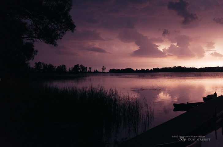 © 2016 Thousand Word Images by Dustin Abbott This is a unique image for in that the only light source here is from a pulse of lightning through the clouds. I shot this at nearly 11:30 at night, and it was otherwise pitch black out. For this split second, though, the whole scene was lit by a giant strobe filtered through the clouds. You can see how deeply crushed the shadows still are, but the bay comes alive with the reflected light. You can see a bolt on the right side of the image. This is Pleasant Bay in Prince Edward County, Ontario. It's amazing how unique lighting conditions can produce very unique images. Right time, right place. Technical Information: Canon EOS 5DsR + Tamron SP 45mm f/1.8 Di VC USD, Processed in Adobe Lightroom CC, Photoshop CC, and Alien Skin Exposure X (use code "dustinabbott" to get 10% off) Want to know more about me or make contact? Take a look at my website and find a lot of ways t