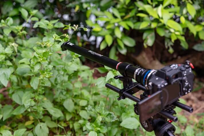 A black object with a long barrel Description automatically generated