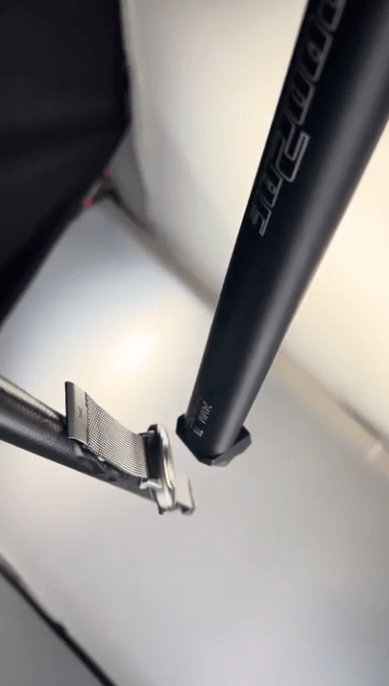 A close up of a metal strap Description automatically generated