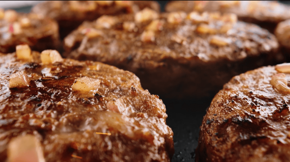 Close-up of a group of meat patties Description automatically generated